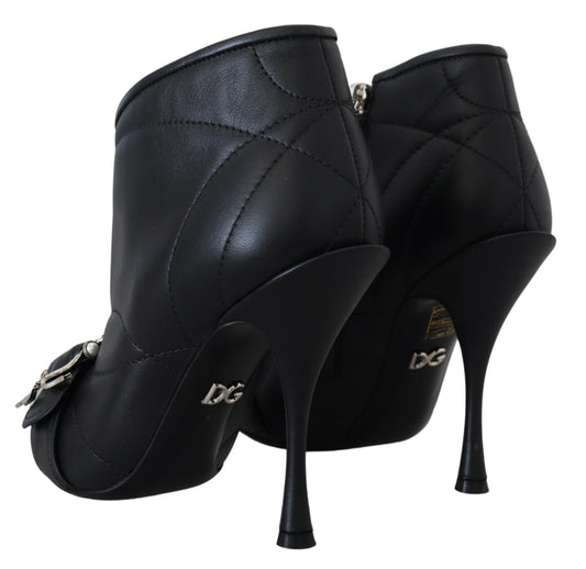 Pair of black high heel shoes with stiletto heels and a zipper on the side
