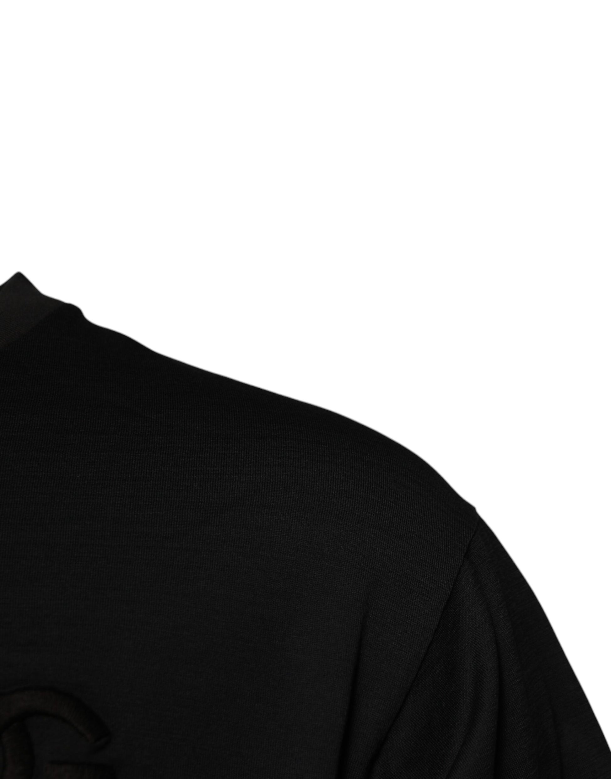 Black sleeveless top with circular pattern on front