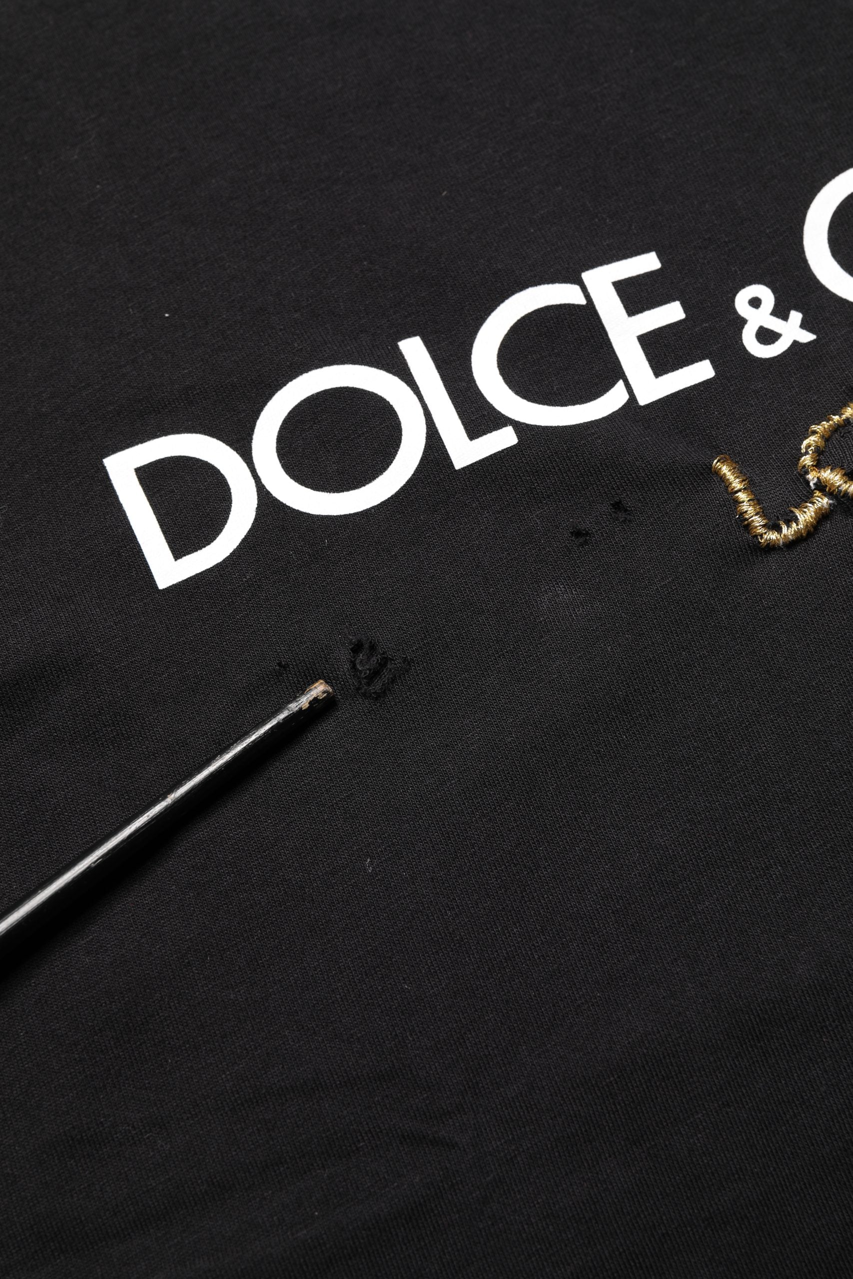 Black fabric with gold lettering