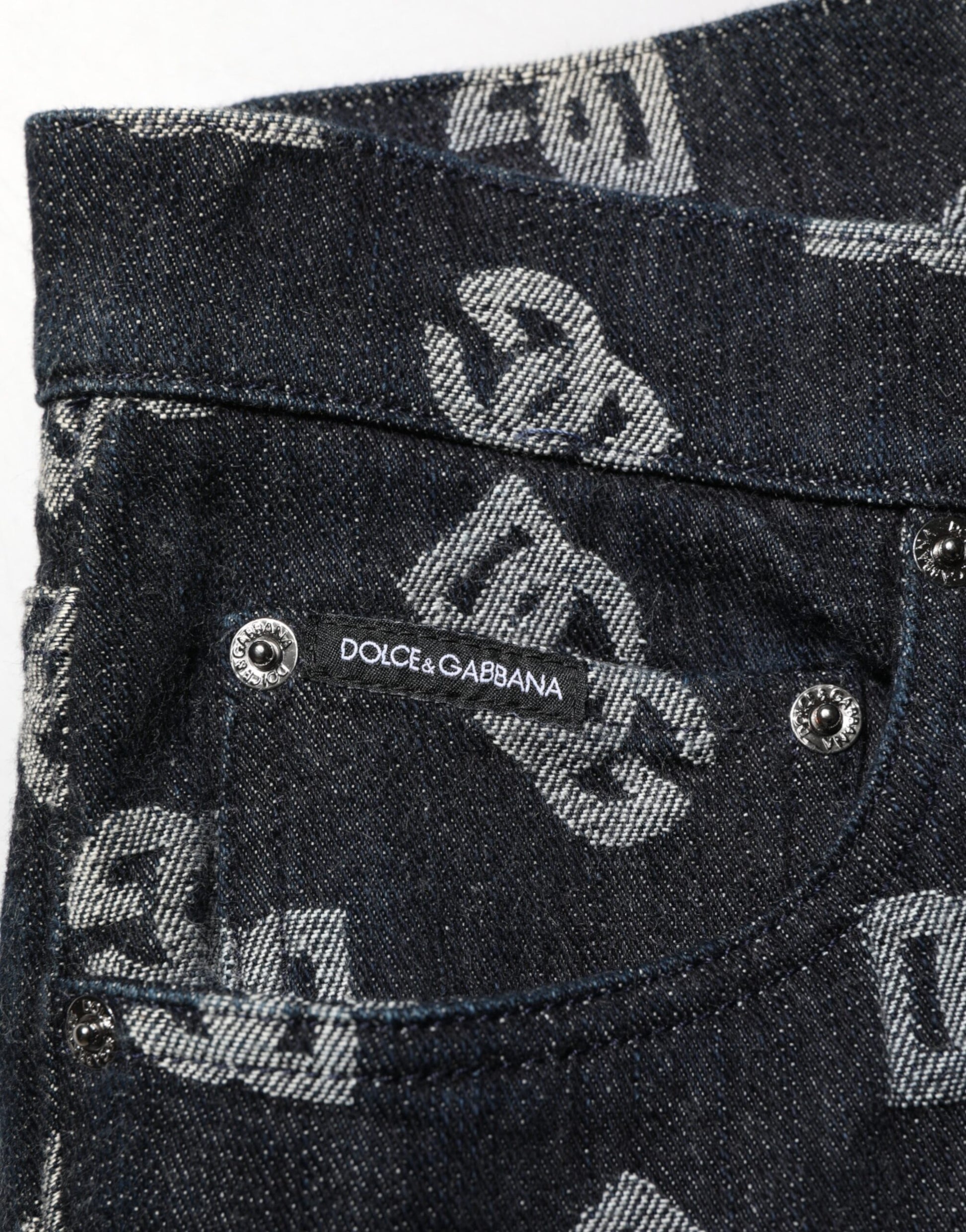 Blue denim jeans with white lettering on front