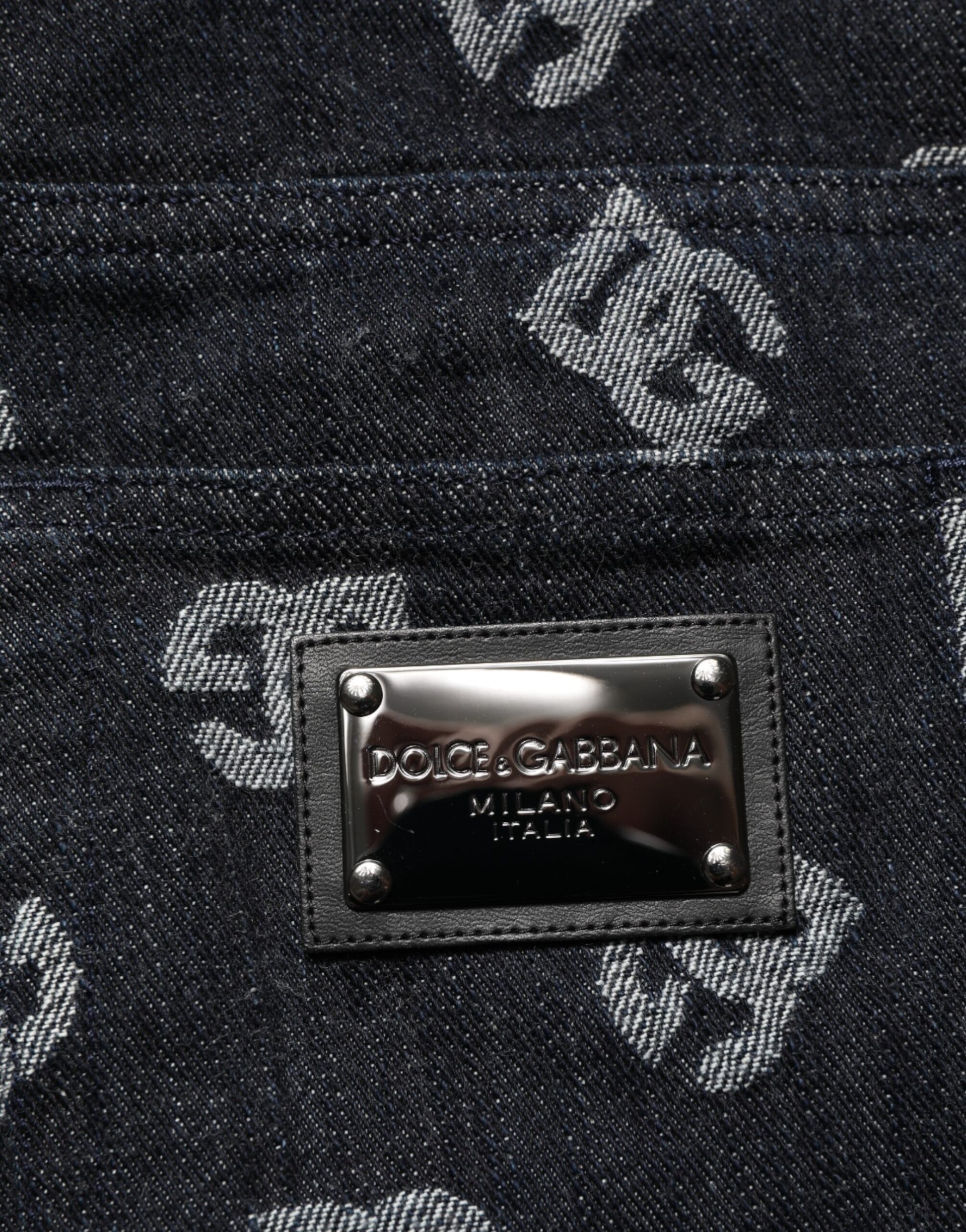 Blue denim jeans with silver logo on waistband