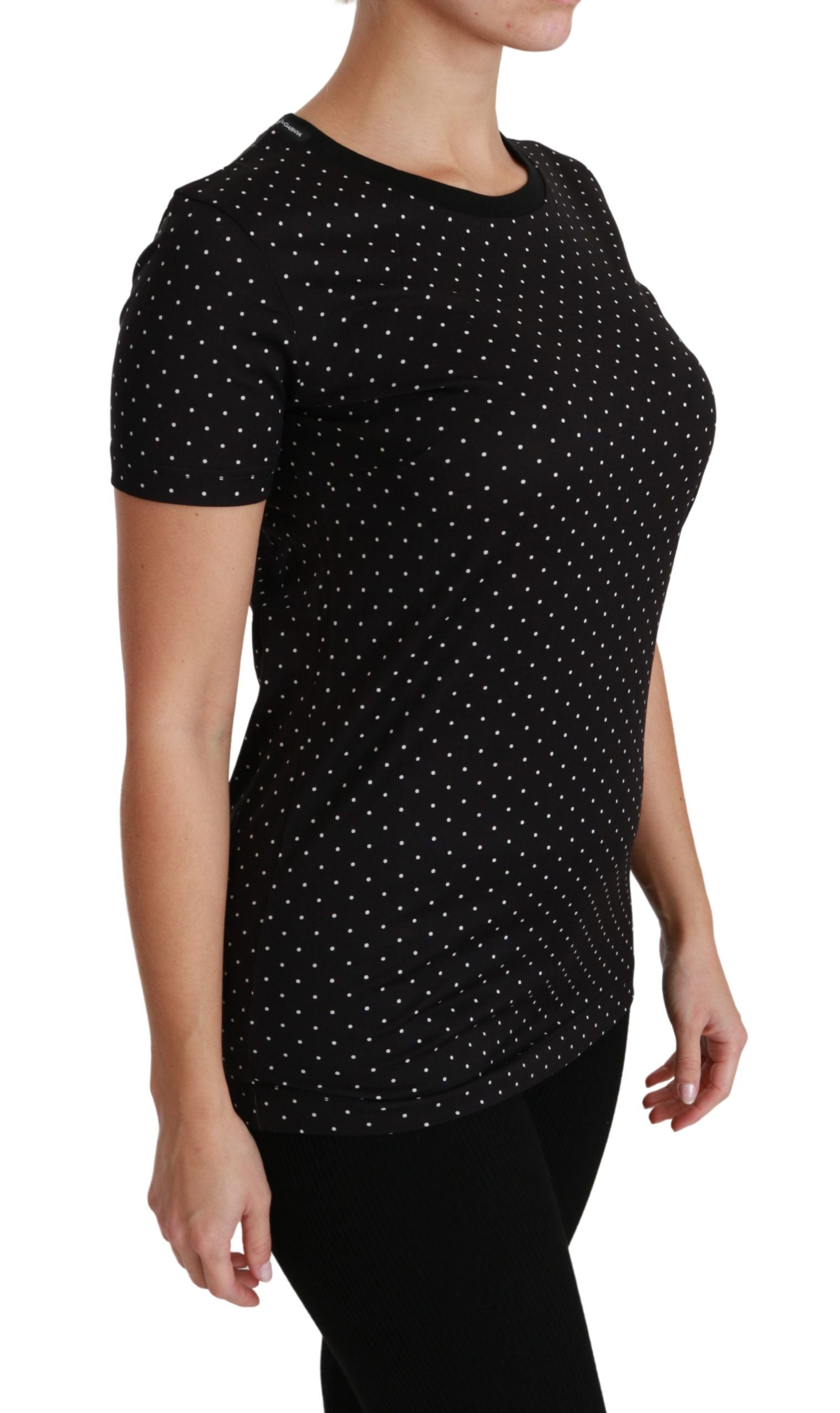 Black polka dot short sleeve shirt on woman