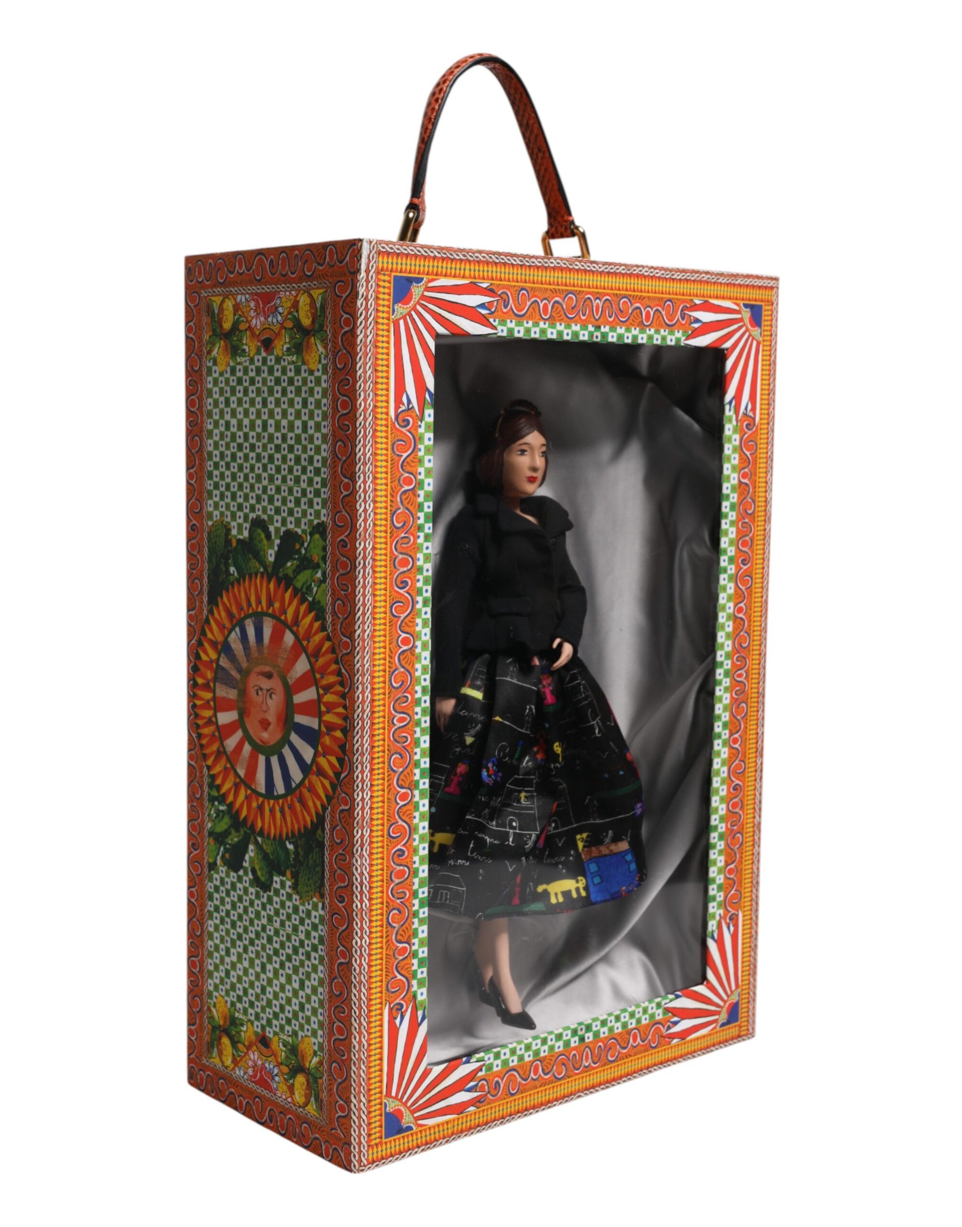A ceramic porcelain doll wearing a black dress with floral patterns