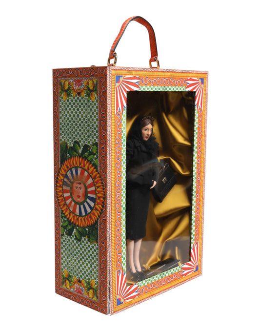 A ceramic porcelain doll wearing a black dress, part of the Dolce & Gabbana fashion collection