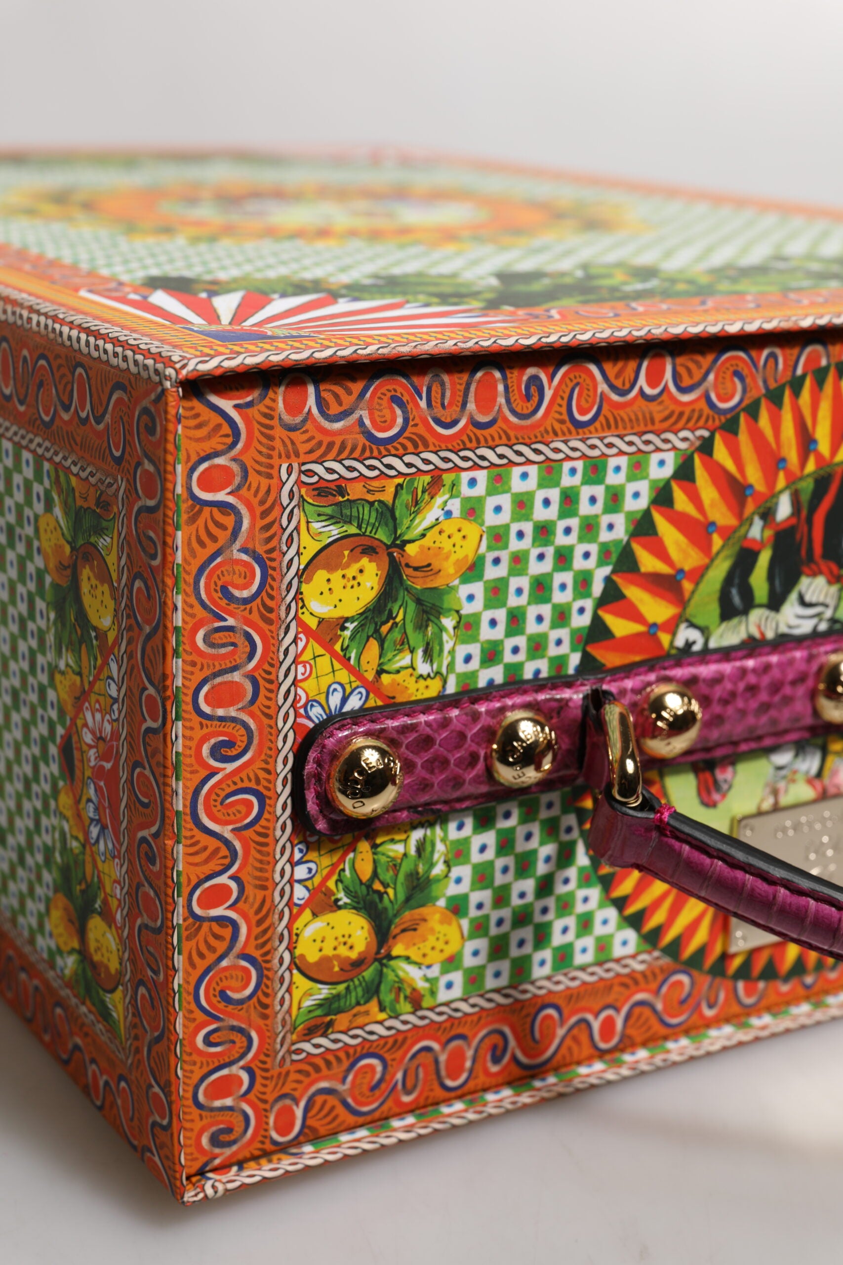 Colorful ceramic box with floral design and gold accents
