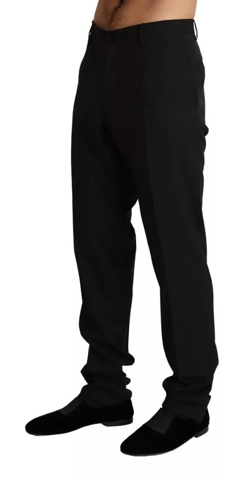 A pair of black dress pants from Dolce & Gabbana. They are designed to be skinny fit and feature a formal sty