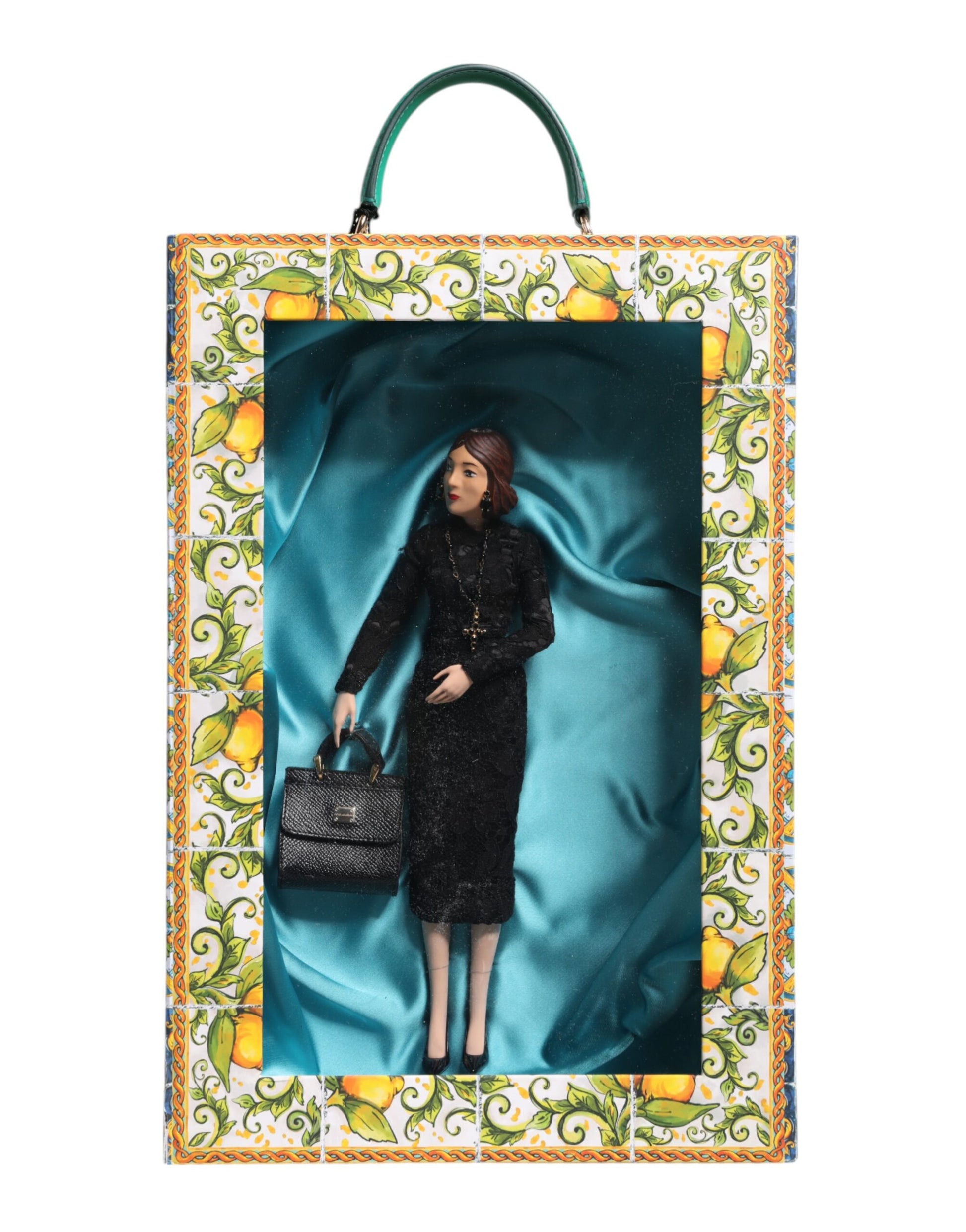 A porcelain doll wearing a black dress with a leather purse