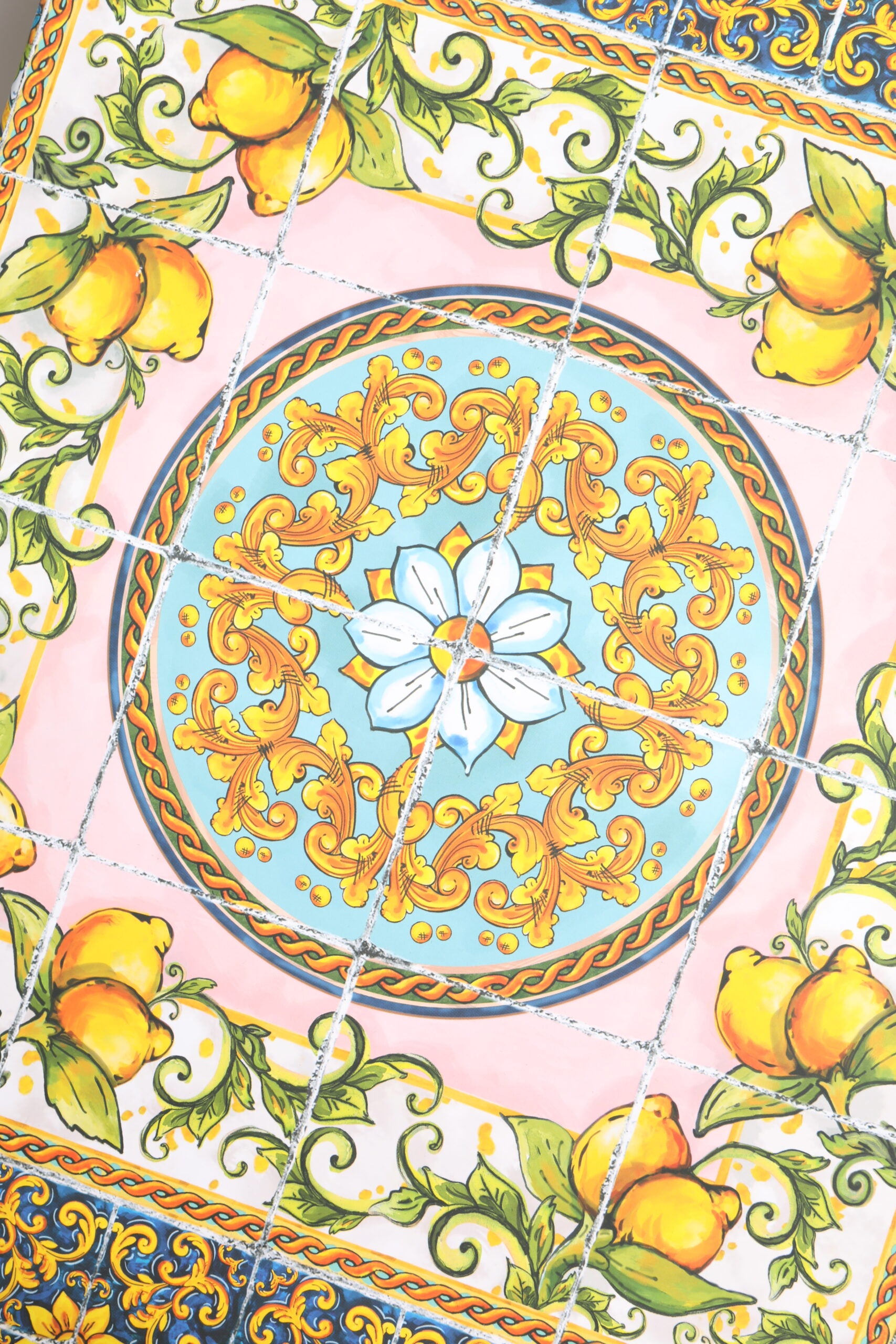 A black dress with floral and fruit designs, part of a porcelain fashion show collection