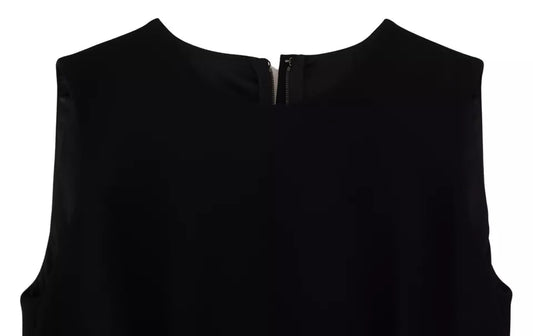 A black dress with a sheath silhouette, flare skirt and viscose fabric