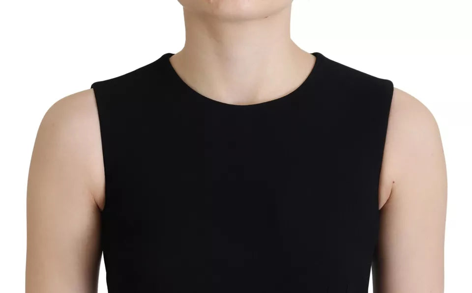 A black dress with a sheath silhouette, flared sleeves and viscose material