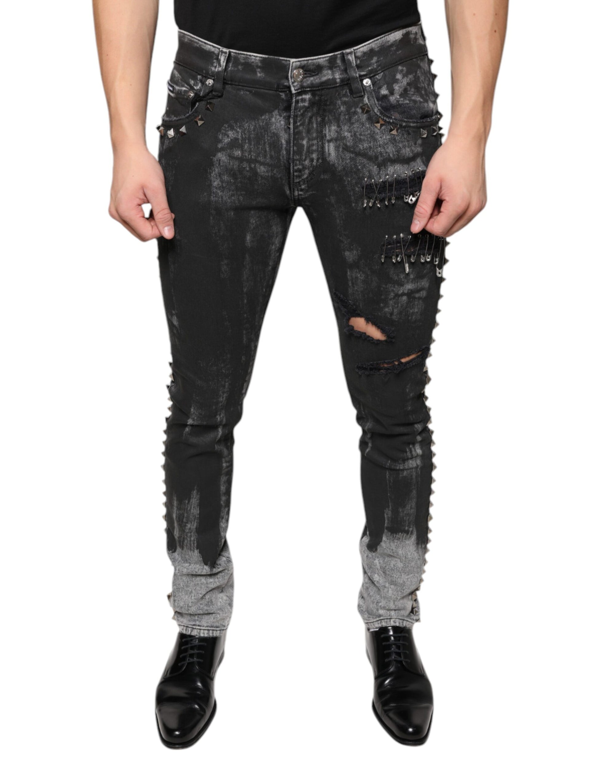Man wearing distressed jeans with rips and tears
