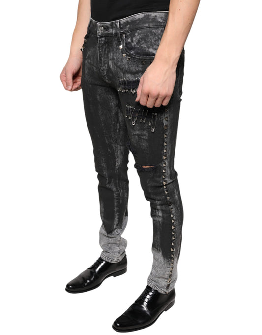 Man wearing distressed jeans with studs and rips
