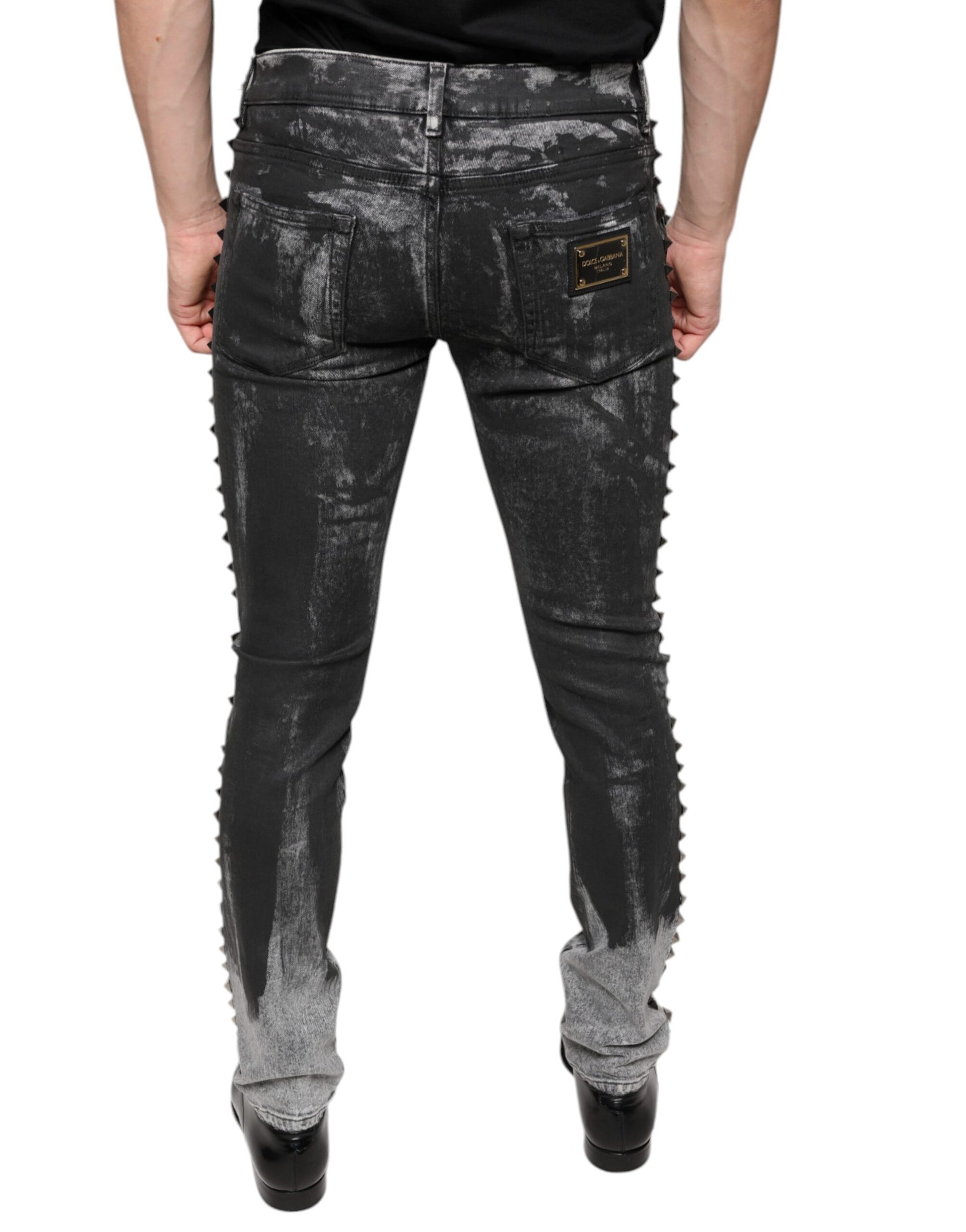 Pair of distressed jeans with zipper details on back
