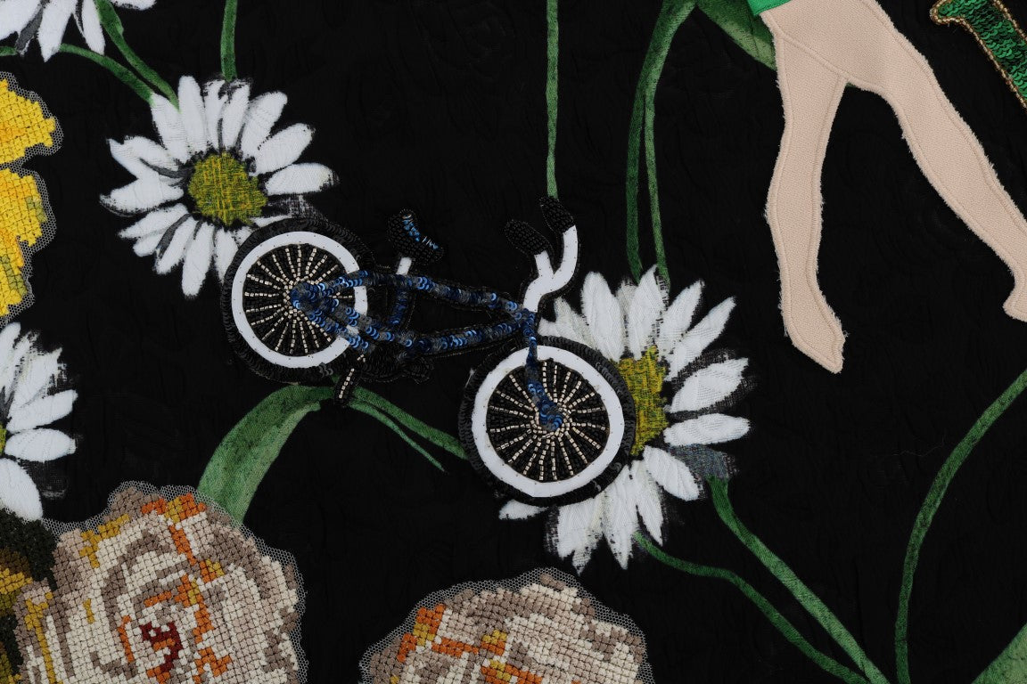 Embroidered floral pattern featuring a bicycle on a black background
