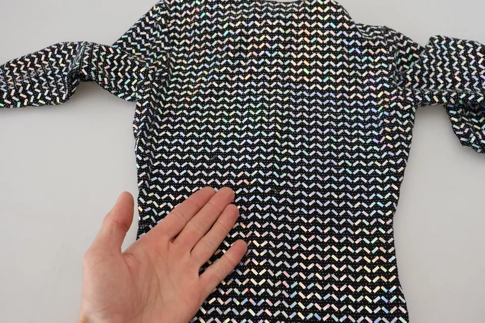 A black dress with glittery sequins and a body-hugging design