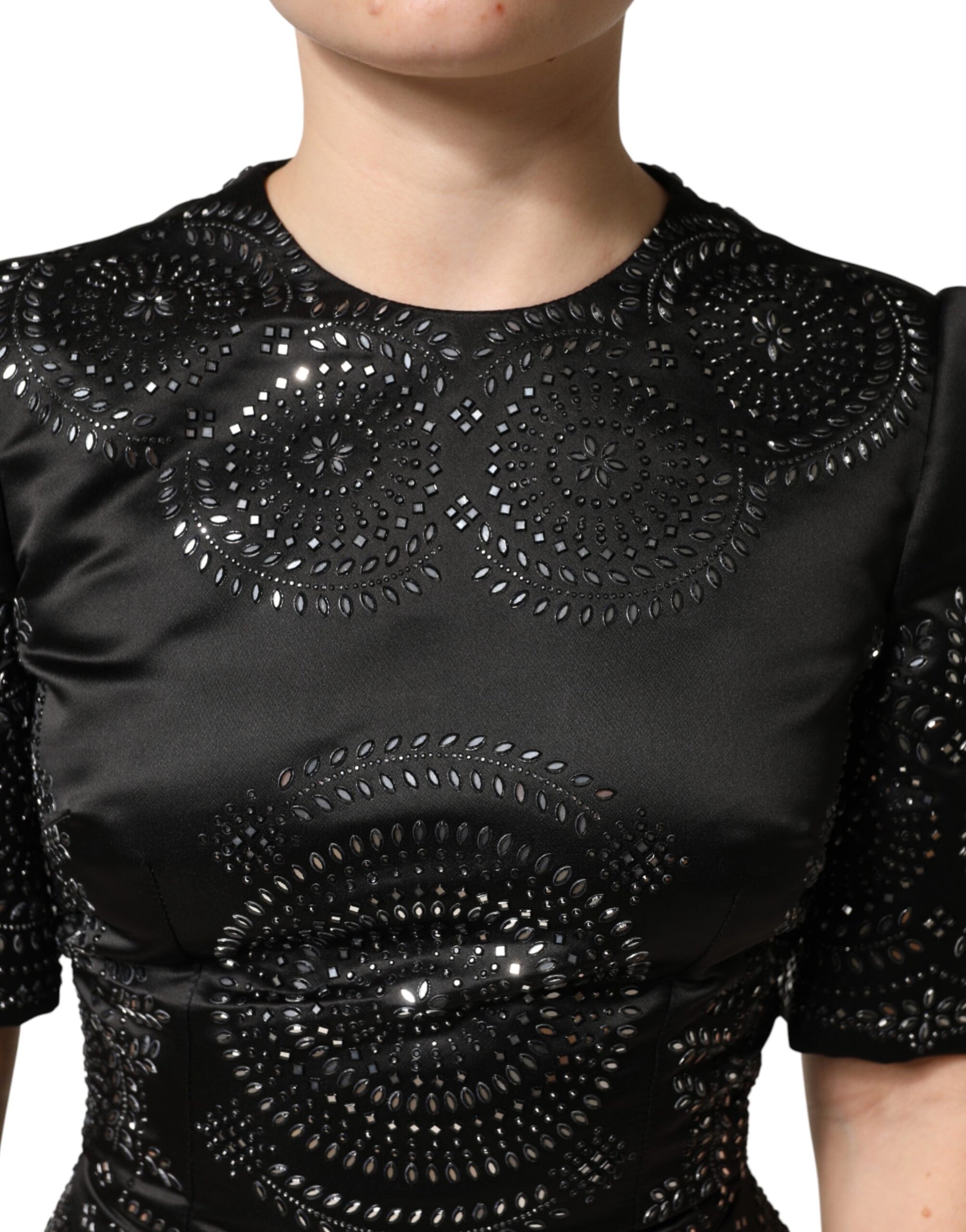 Black sequined top with embellishments on chest area