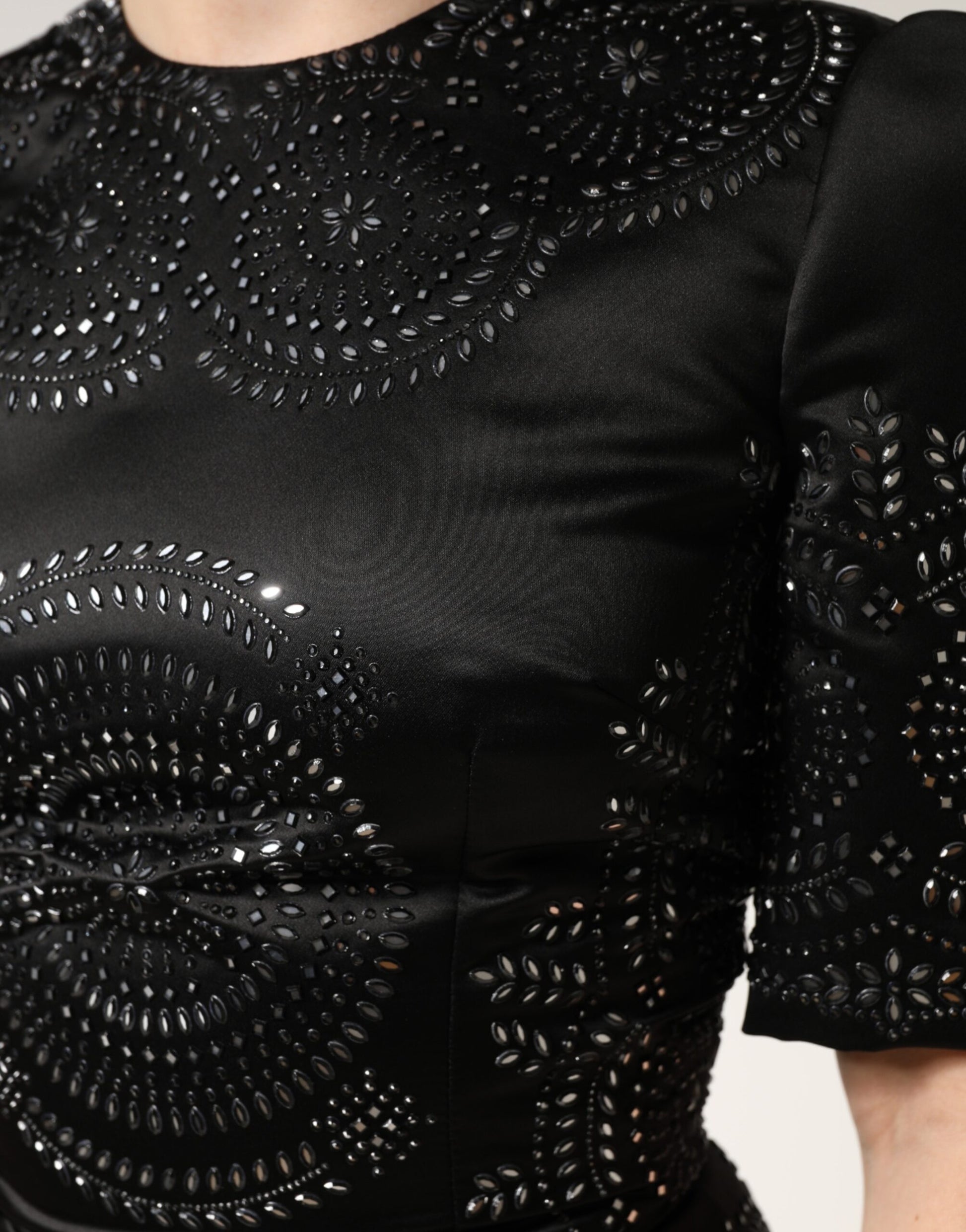 Black sequined dress with embellishments on shoulders