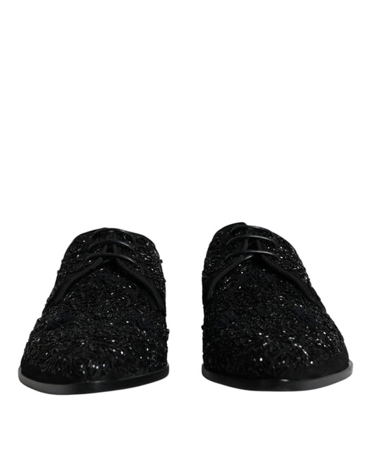 Pair of black glittery slippers