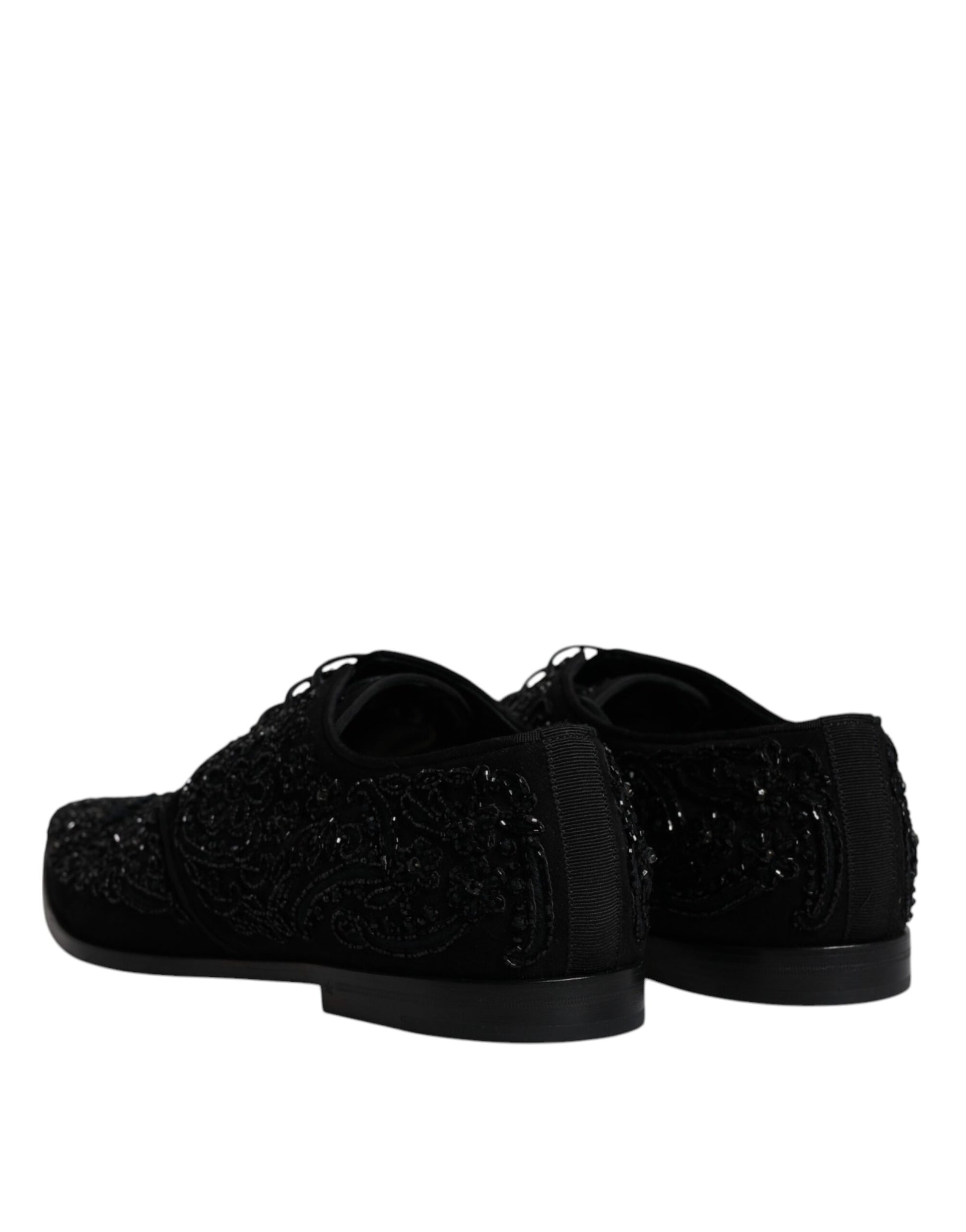 Pair of black shoes with sparkly embellishments on top