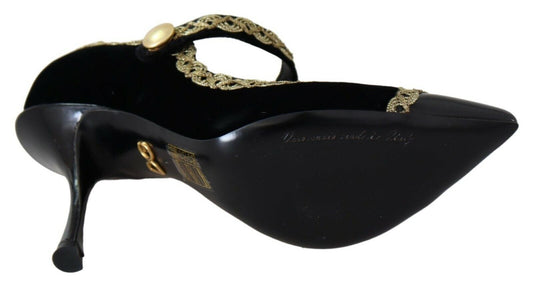 Black high heel shoe with gold accents and a bow on top