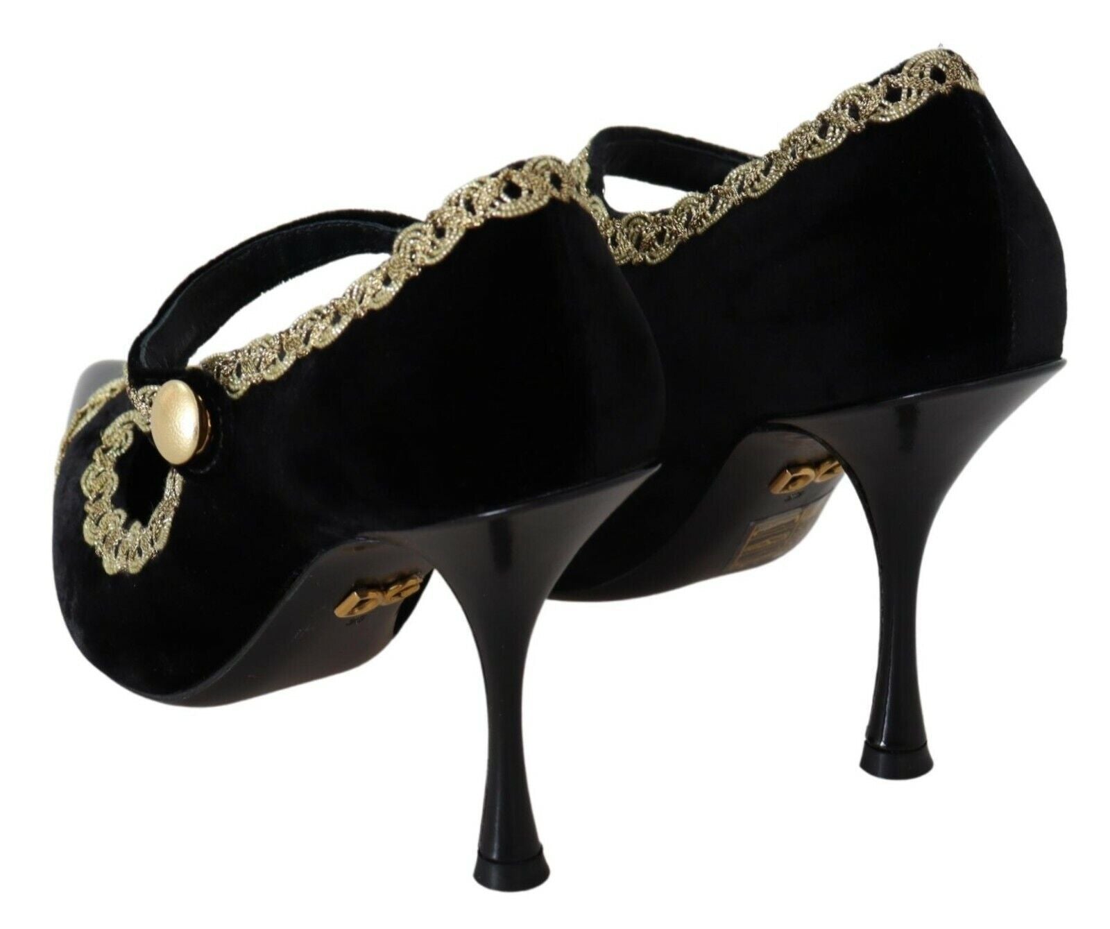 Pair of black high heel shoes with gold accents and a bow on top