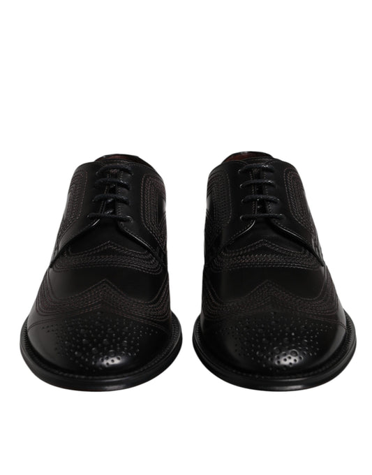 Pair of black embroidered leather dress shoes with laces and a small heel