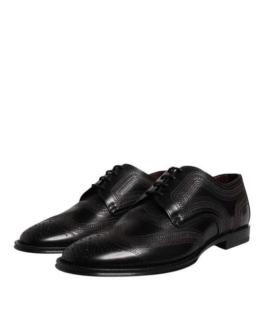 Pair of black embroidered leather dress shoes with laces and elastic, featuring a classic design