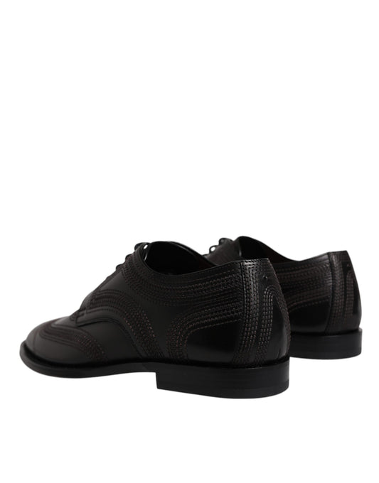 Pair of black embroidered leather dress shoes with laces and a small heel
