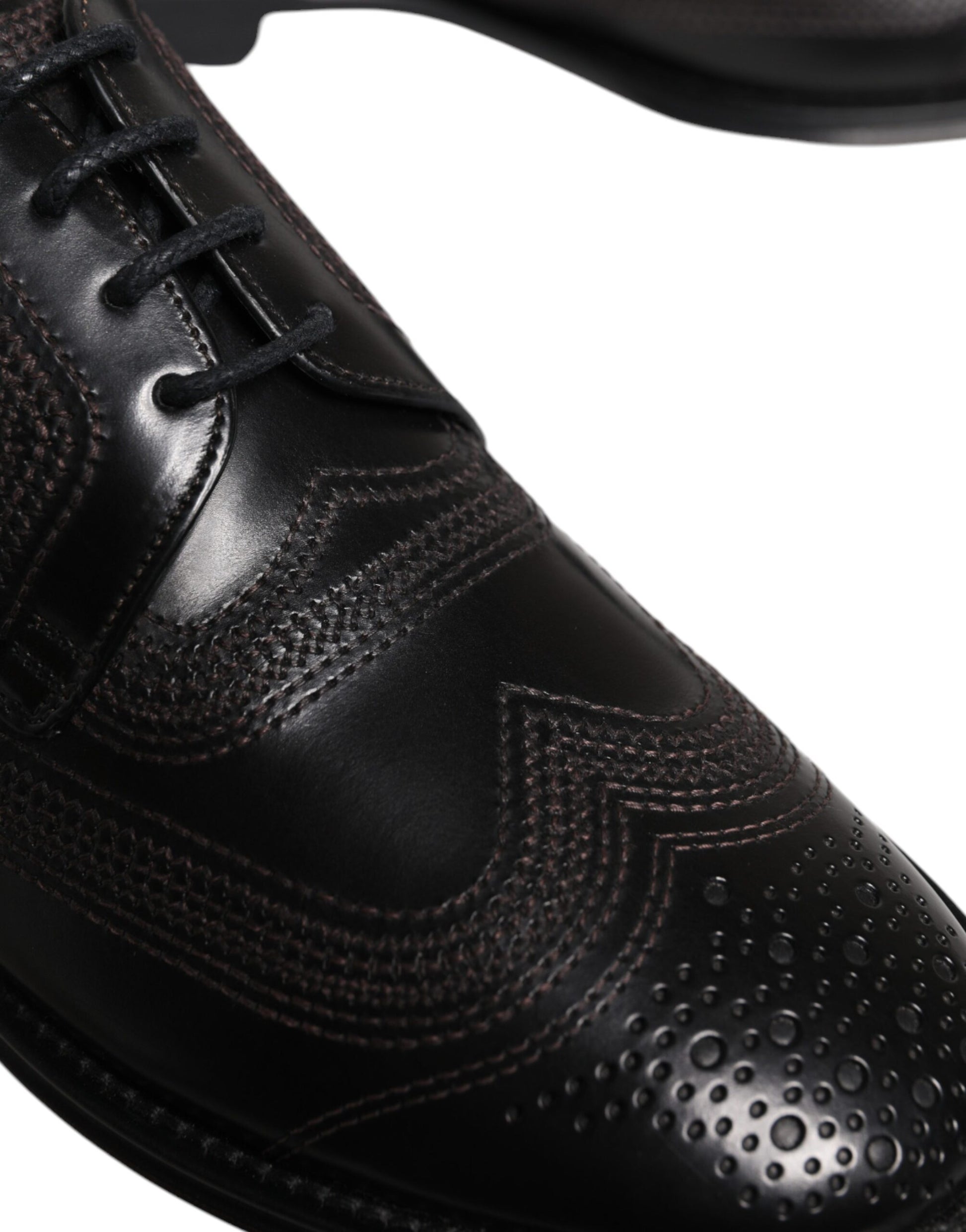 A pair of black embroidered leather dress shoes with a classic design, featuring a derby style and laces