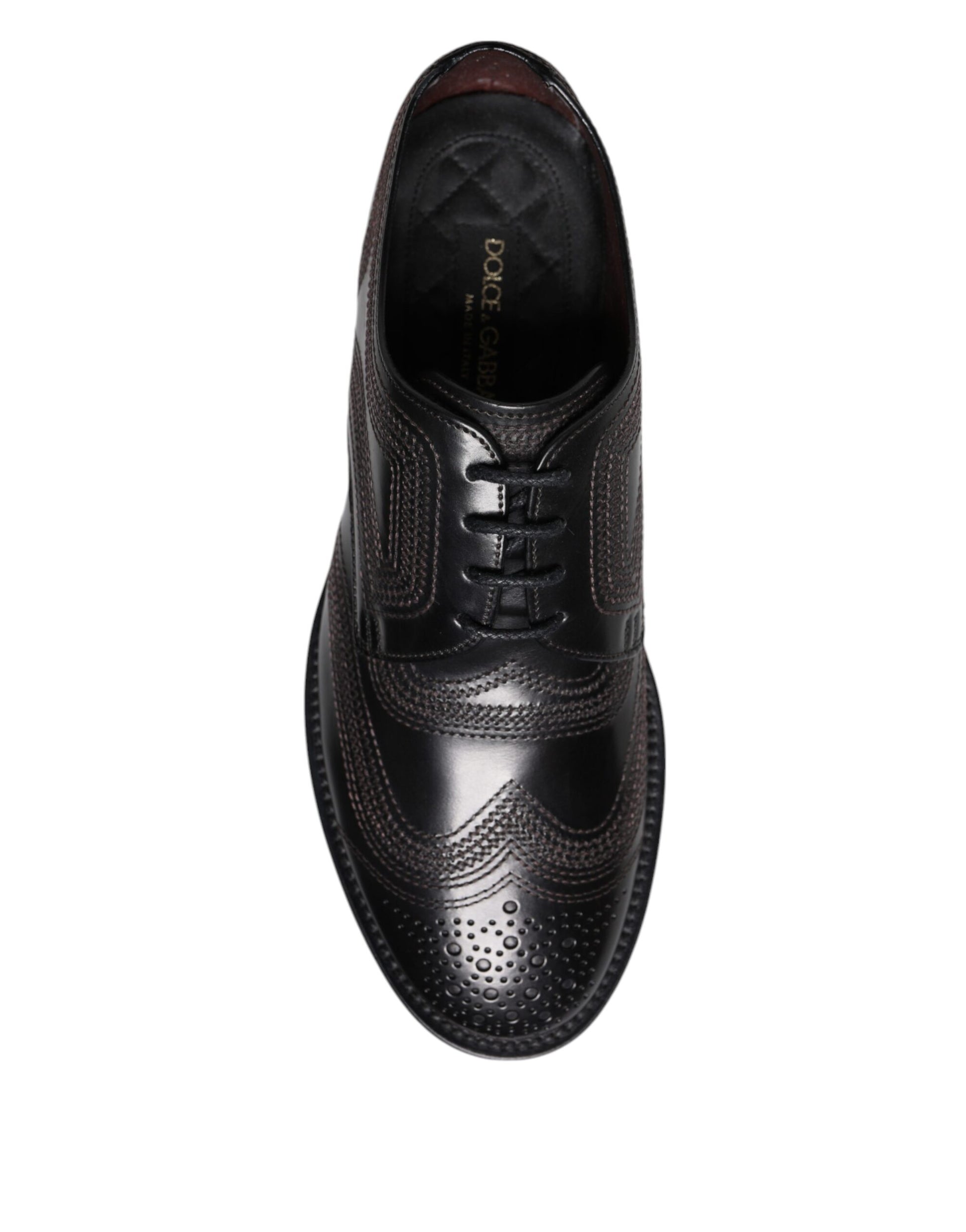 A pair of black embroidered dress shoes with a lace-up front, designed by Dolce & Gabbana