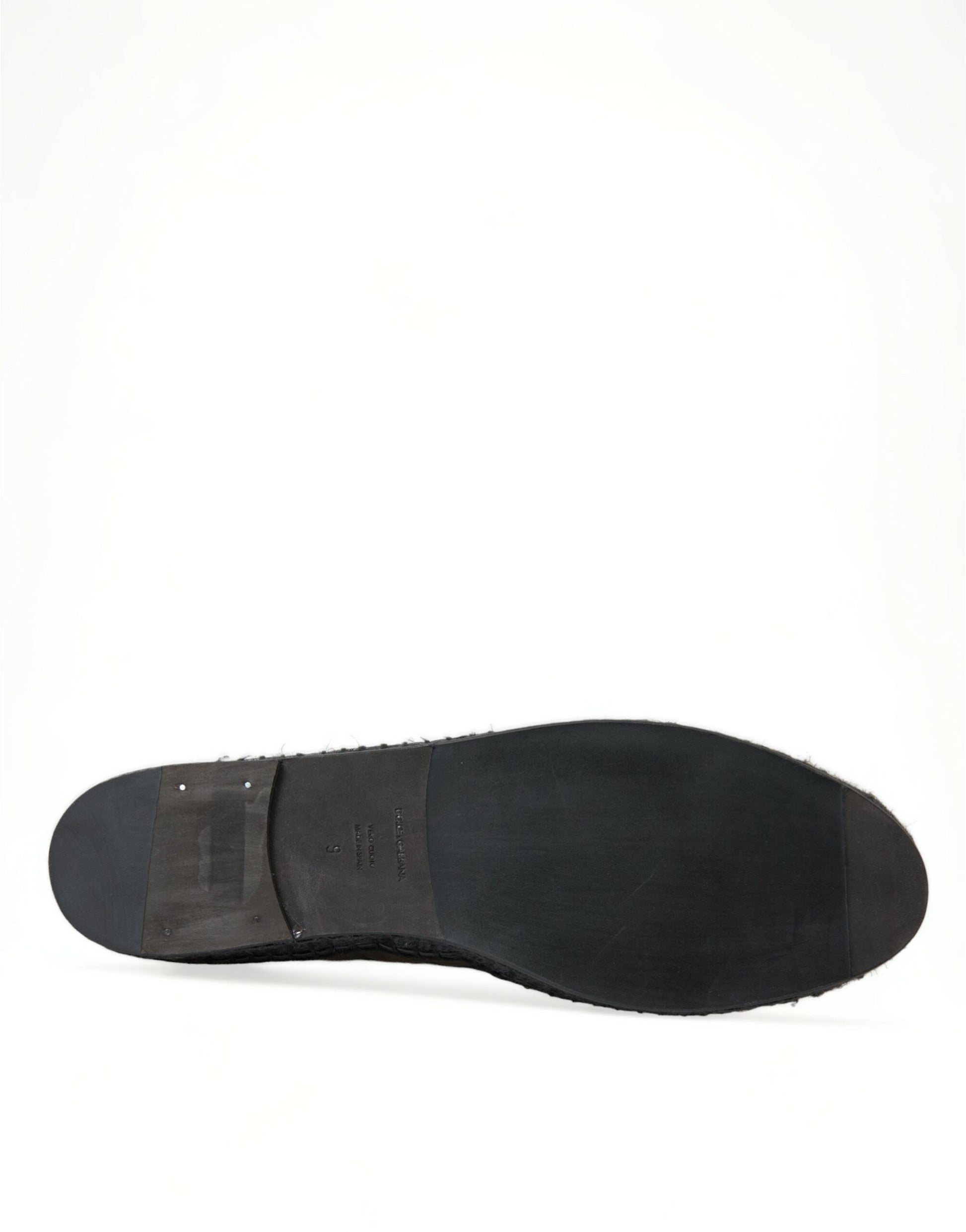 Black shoe with laces and a rubber sole