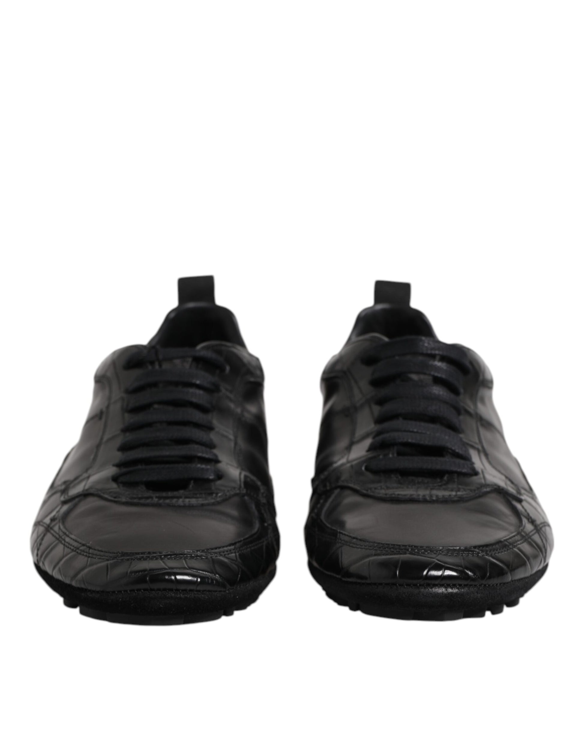 Pair of black exotic leather low top sneakers with laces and a logo on the side