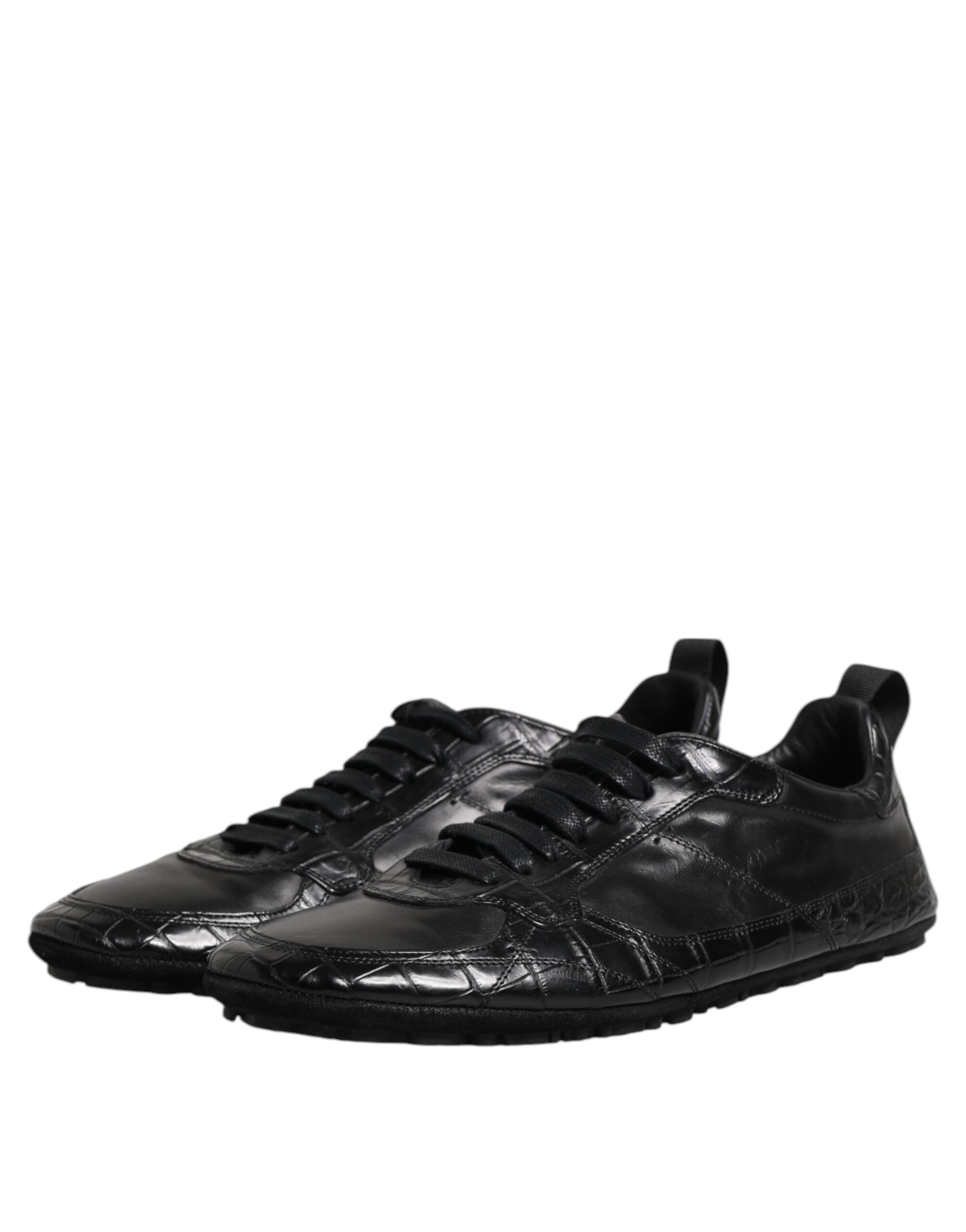 A pair of black exotic leather low top sneakers with a lace-up front