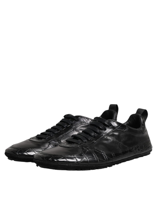 A pair of black exotic leather low top sneakers with a lace-up front