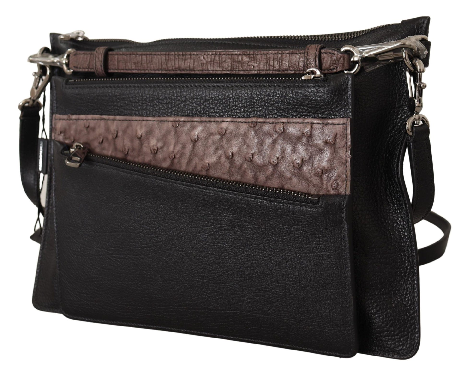 Black leather crossbody bag with brown trim and silver hardware