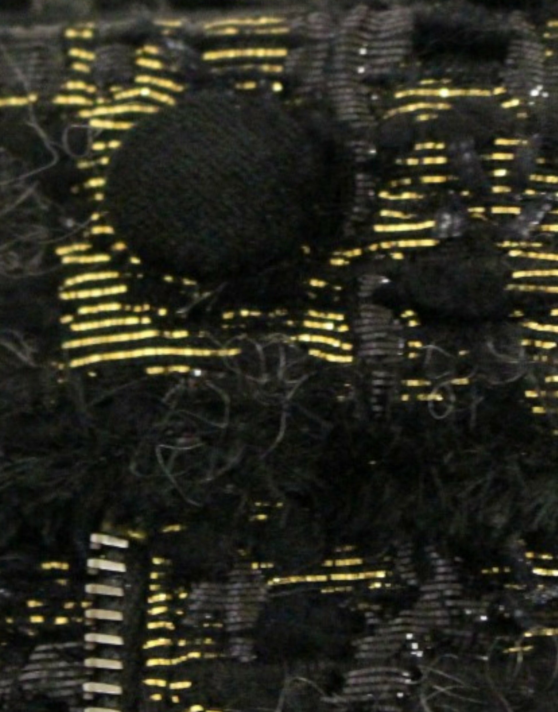 Yellow embroidery on black fabric