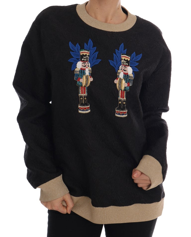 Black sweater with two blue flamingos on front