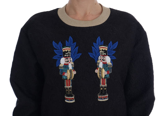 Blue sweater with Christmas tree embroidery on front