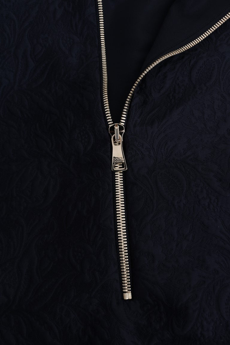 Gold chain necklace on black fabric background