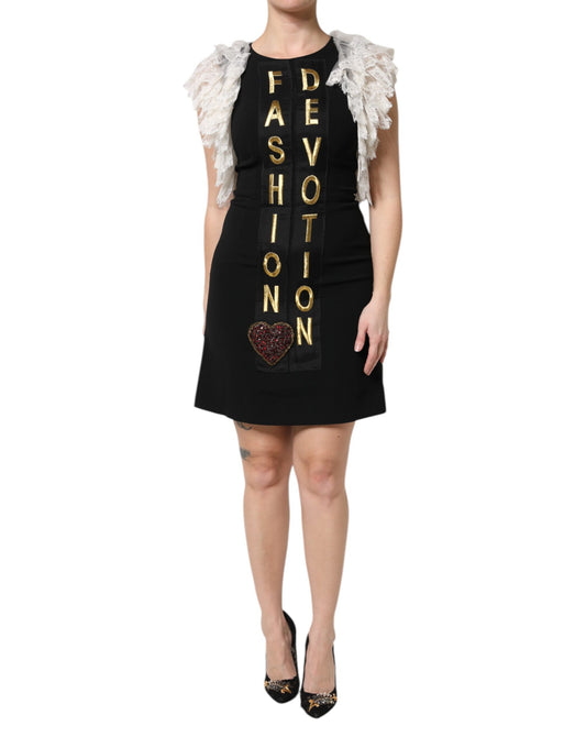 A black dress with embellishments, featuring a heart-shaped design and the words "Fashion Devotion" in gold lettering
