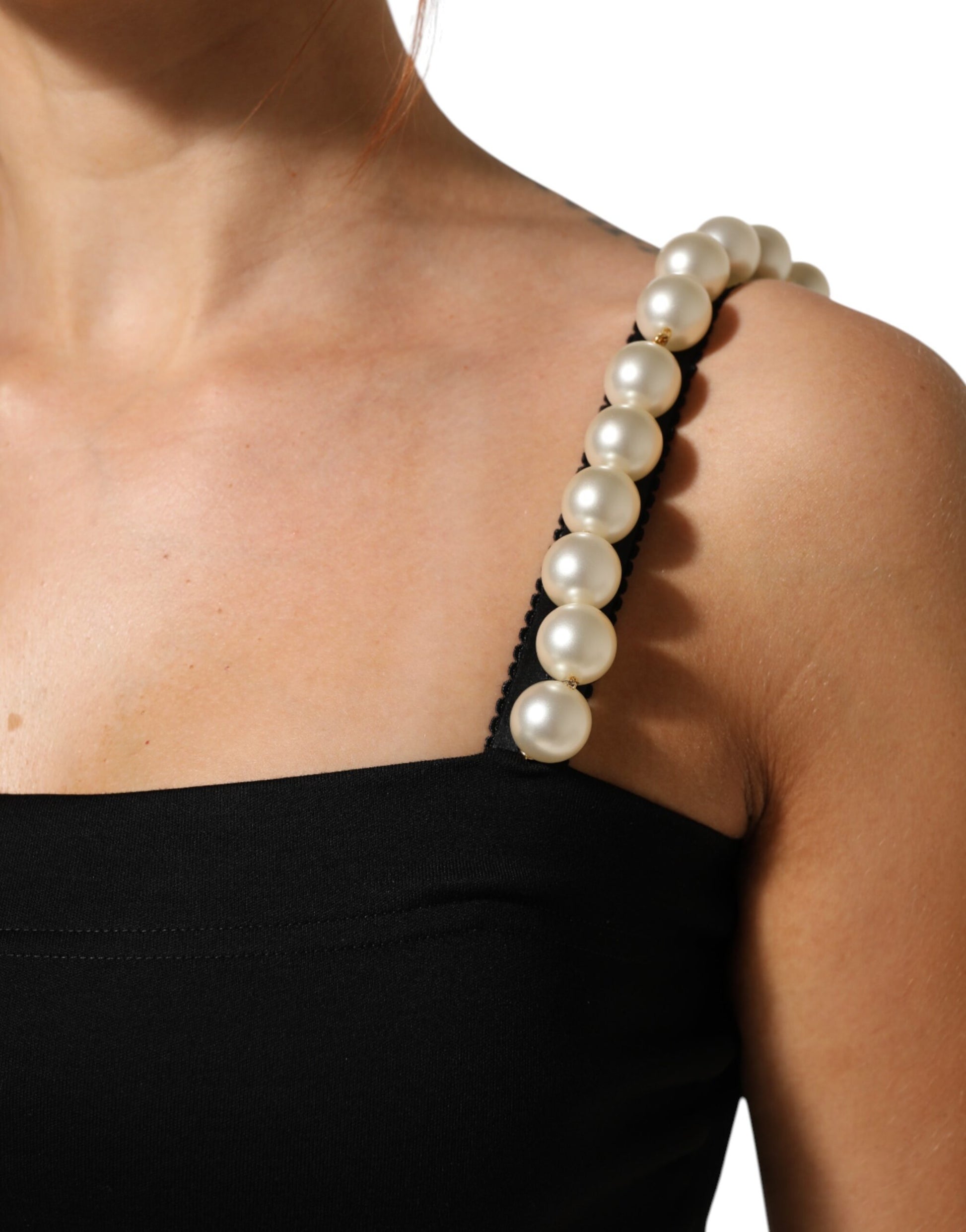 A black dress with a faux pearl neckline
