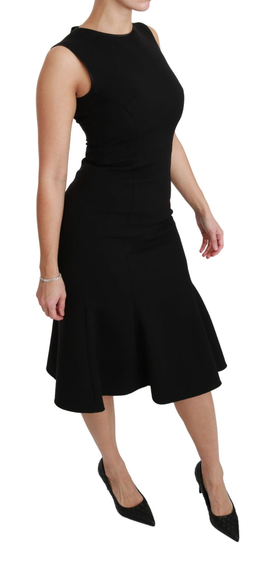 A black fit flare wool stretch sheath dress by Dolce & Gabbana