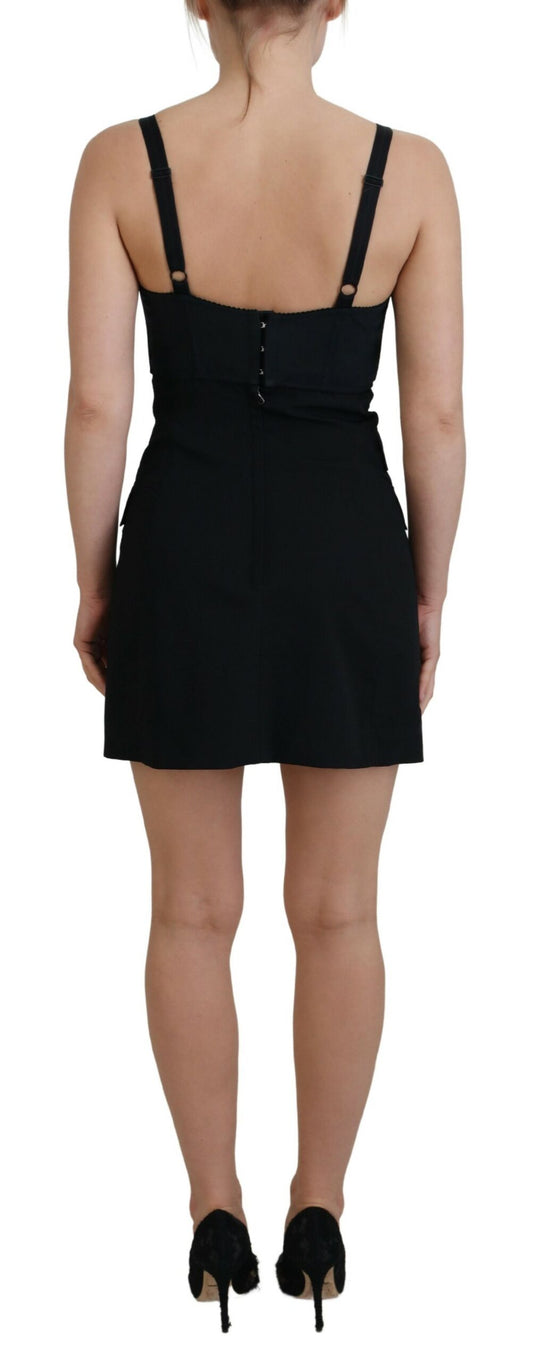 A black dress with a fitted waist, short sleeves and a V-neckline