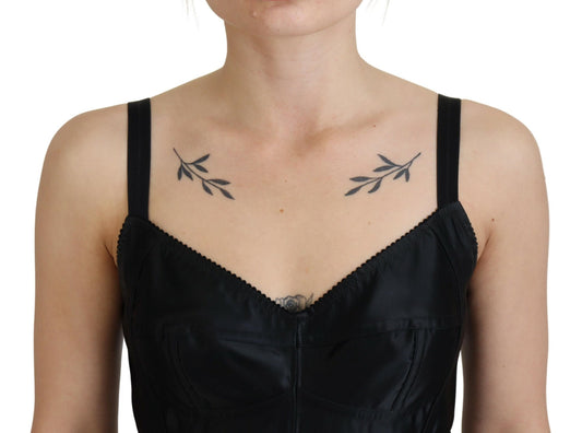 A black dress with a sheer neckline and wool stretch fabric