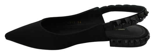 Pair of black shoes with white soles and laces