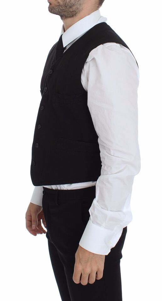 A black vest with a flax cotton dress shirt underneath, part of the Dolce & Gabbana collection