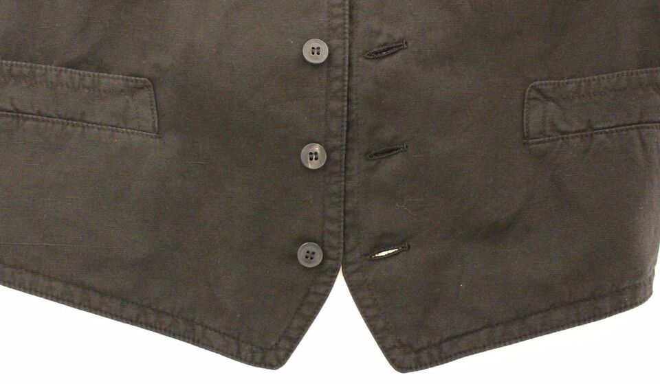 A black flax cotton vest blazer with two buttons and a pocket on the left chest