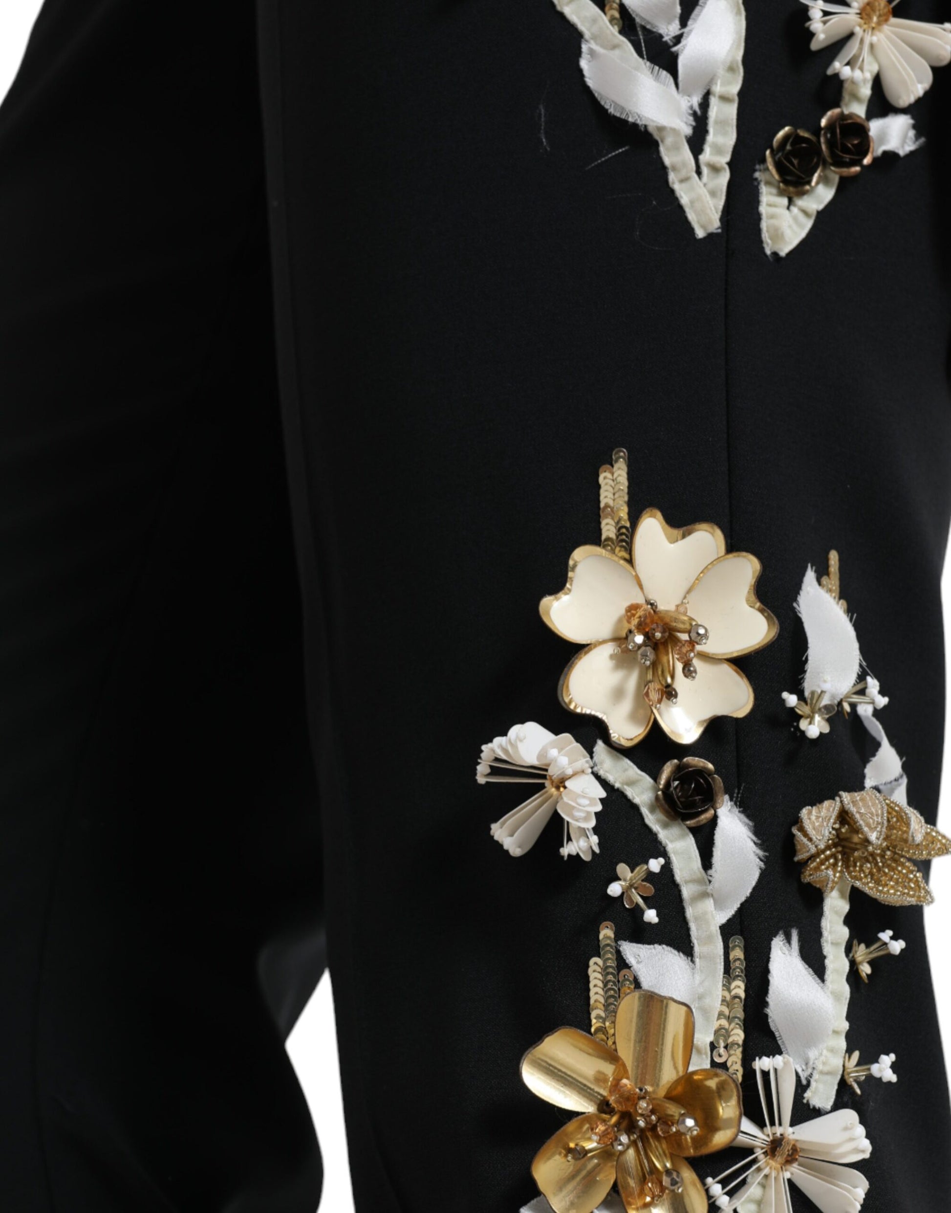 Decorative embellishments on a black suit jacket