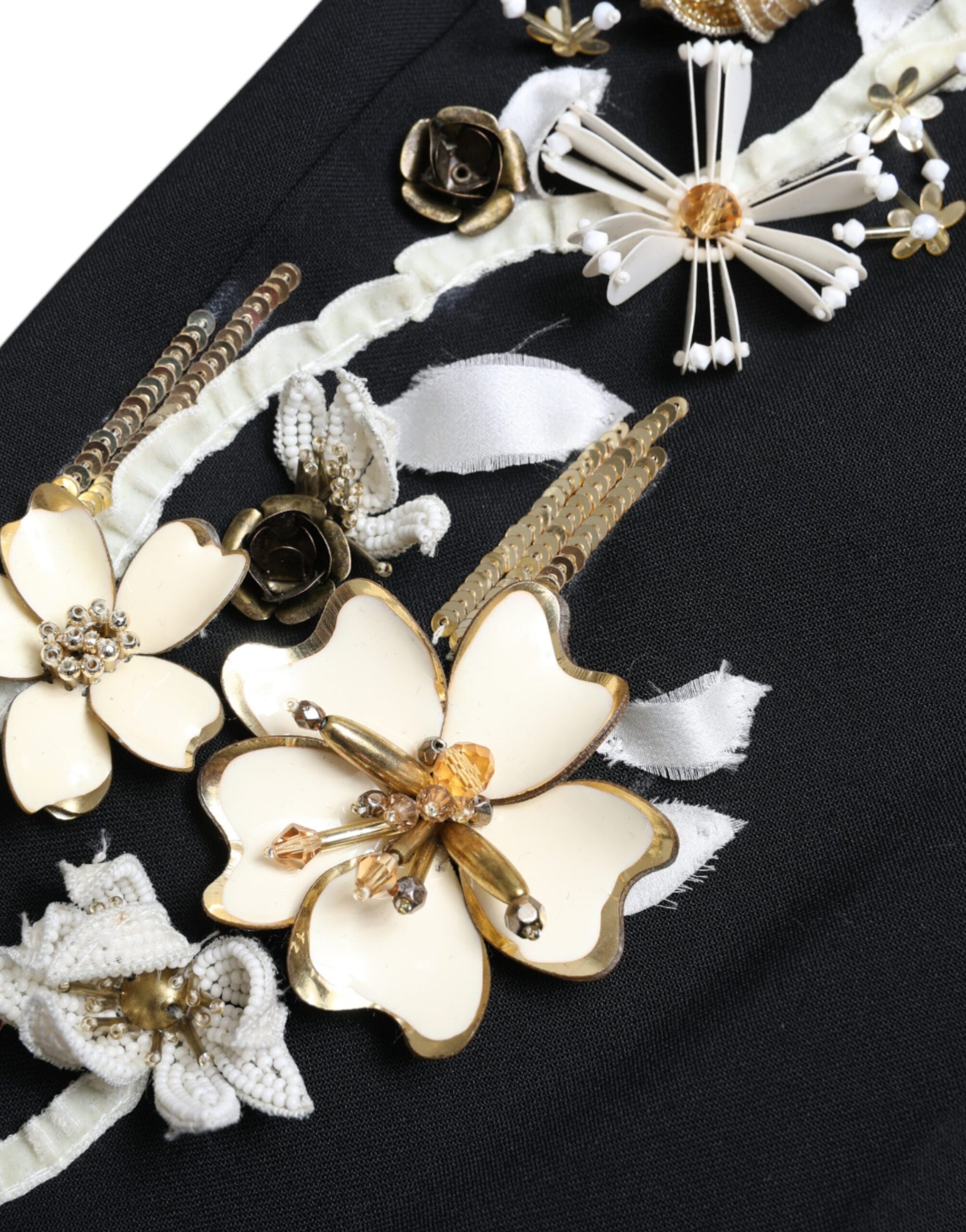 Decorative brooches on a black fabric background