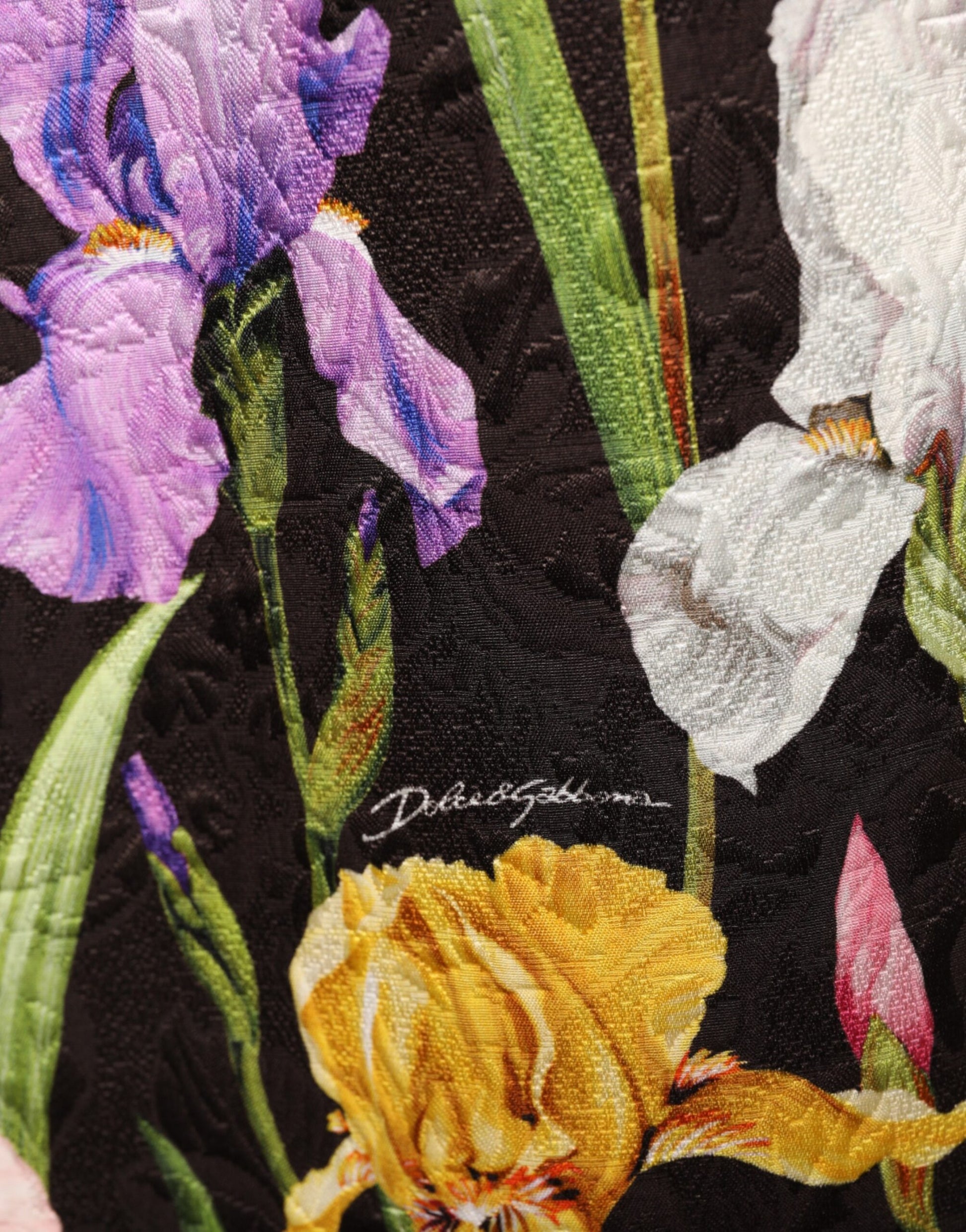 A black floral brocade dress with an A-line silhouette